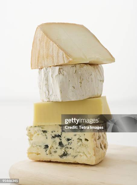 a stack of cheese - cheese stockfoto's en -beelden
