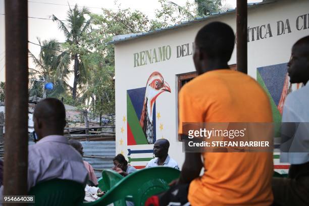 Militants of the opposition party RENAMO gather at a party office in Beira on May 4, 2018 to mourn the death of their historical leader Afonso...