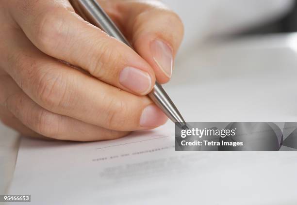 Paper Fill Out Man Filling Out Paperwork Photos and Premium High Res Pictures - Getty ...
