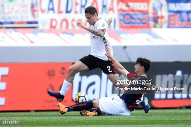 Davide Calabria of AC Milan competes the ball with Riccardo Orsolini of Bologna FC during the serie A match between Bologna FC and AC Milan at Stadio...