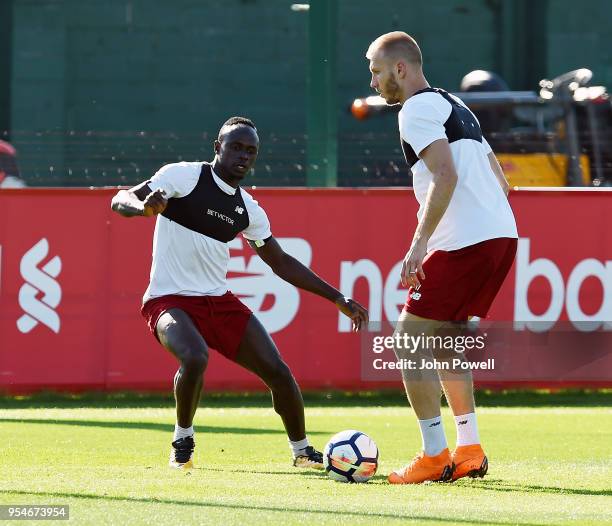 Sadio Mane and Ragnar Klavan of Liverpool during a training session at Melwood Training Ground on May 4, 2018 in Liverpool, England.