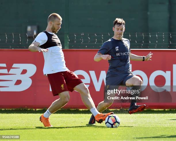 Ragnar Klavan and Conall Murtagh First-team fitness coach of Liverpool during a training session at Melwood Training Ground on May 4, 2018 in...