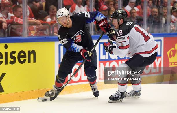 Nick Jensen of Team USA and Pierre-Luc Dubois of Team Canada during the World Championship game between USA and Canada at Jyske Bank Boxen Arena on...