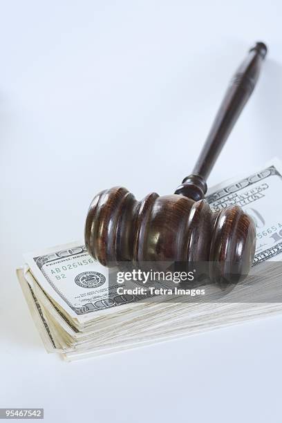 gavel on a stack of bills - alimony imagens e fotografias de stock