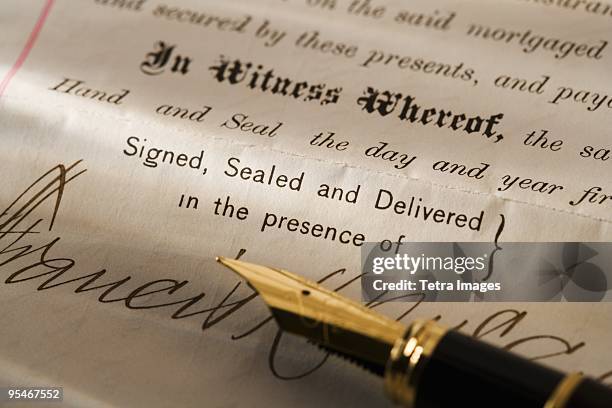 fountain pen on a legal document - antique fountain pen stock pictures, royalty-free photos & images