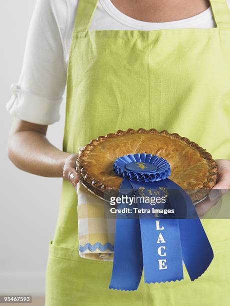 woman holding first place pie - baking competition stock pictures, royalty-free photos & images