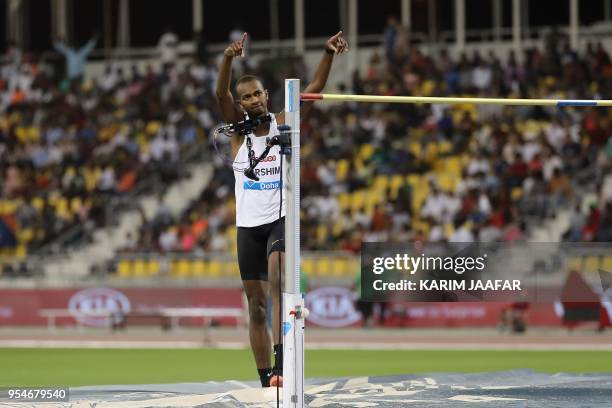 Qatar's Mutaz Essa Barshim celebrates after winning in the men's high jump during the Diamond League athletics competition at the Suhaim bin Hamad...