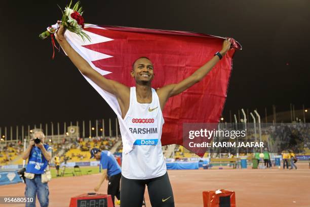 Qatar's Mutaz Essa Barshim celebrates after winning in the men's high jump during the Diamond League athletics competition at the Suhaim bin Hamad...