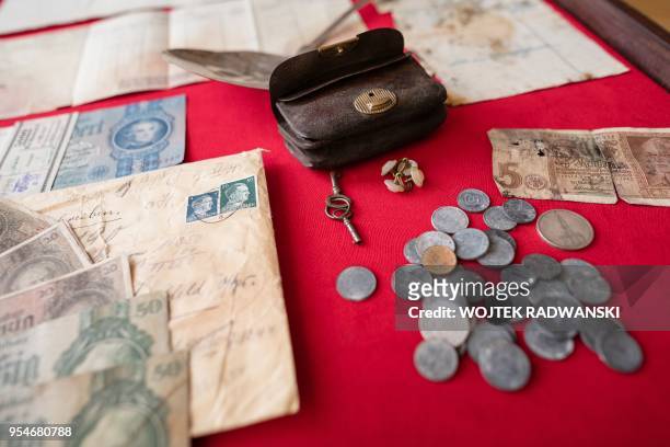 Money, documents and other personal belongings of Graf Hans Joachim von Finckenstein are seen on May 4, 2018 in Ilawa, northern Poland. - "This is a...
