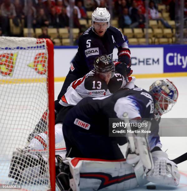 Keith Kinkaid, goaltender of United States makes a save on Matt Barzal of Canada battle for the puck during the 2018 IIHF Ice Hockey World...