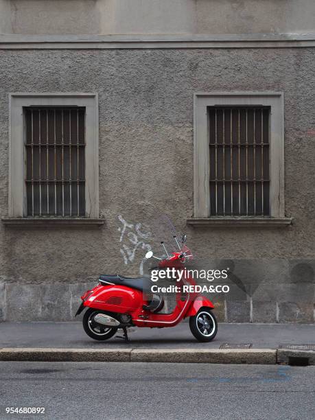 Via Tortona street, red Vespa scooter, Milan, Lombardy, Italy, Europe.