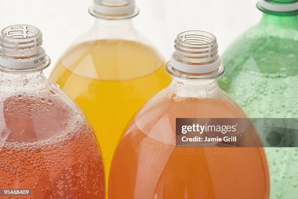 soda bottles - food coloring stock pictures, royalty-free photos & images