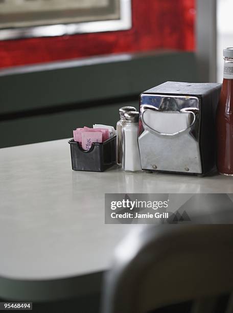 diner table - napkin holder stock pictures, royalty-free photos & images
