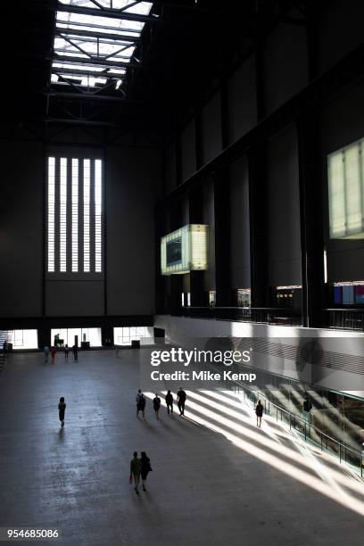 Interior view of evening light falling inside the Turbine Hall at Tate Modern gallery of contemporary art in London, England, United Kingdom. Tate...