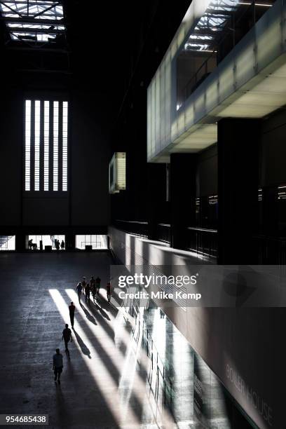 Interior view of evening light falling inside the Turbine Hall at Tate Modern gallery of contemporary art in London, England, United Kingdom. Tate...