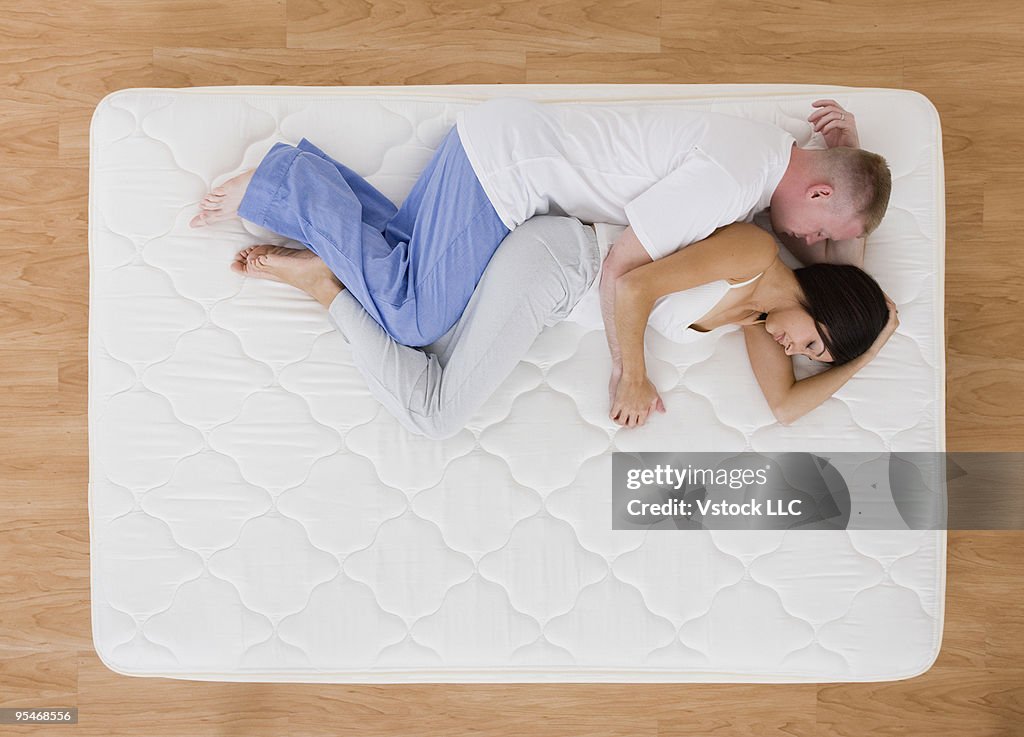 Young couple on bed