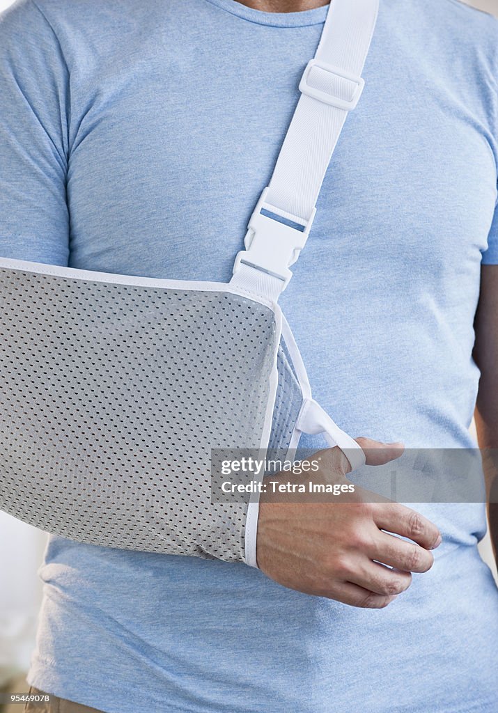 Man with arm in sling