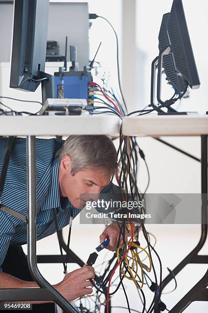 Working Under Table 251 Man Looking Under Table Stock Photos, High-Res Pictures, and Images ...