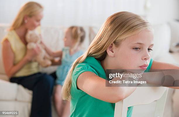 child feeling left out - jealous sister stock pictures, royalty-free photos & images