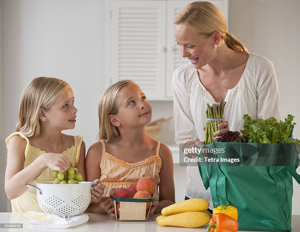 Mother and daughters in the kitchen