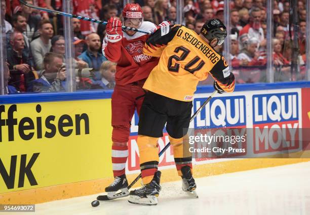 Oliver Bjorkstrand of Team Danmark and Dennis Seidenberg of Team Germany during the World Championship game between Germany and Denmark at Jyske Bank...