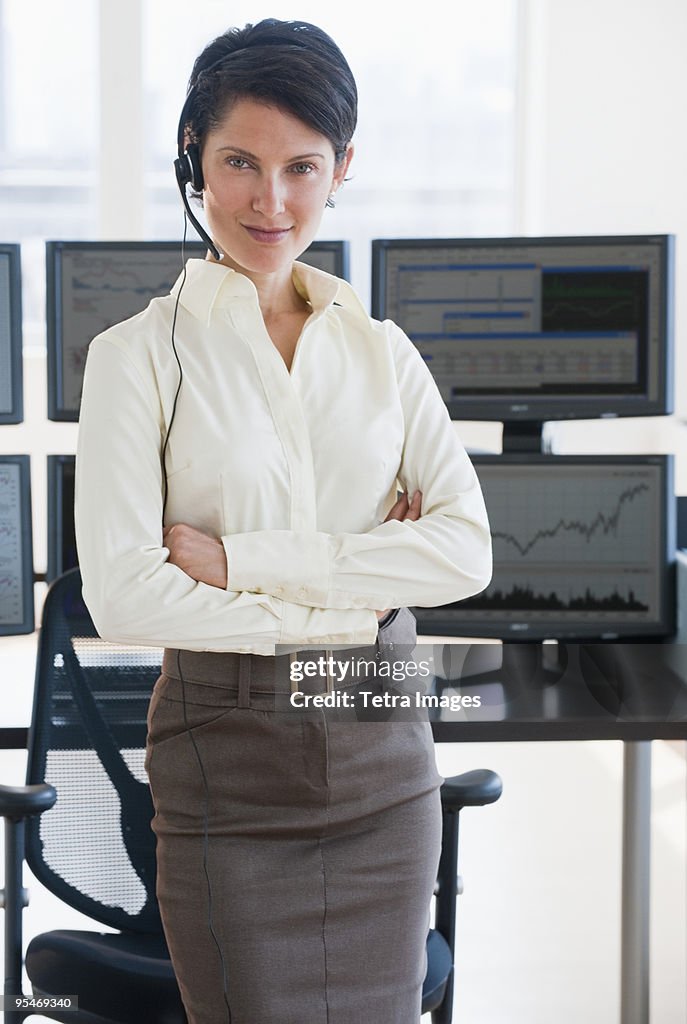 Female trader looking at camera