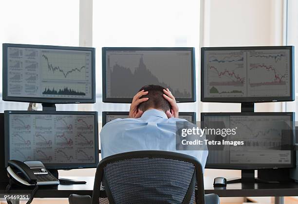 frustrated male trader at work - multiple screens stock pictures, royalty-free photos & images