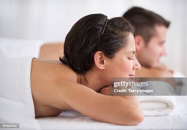 couple at spa - girlfriend massage ストックフォトと画像