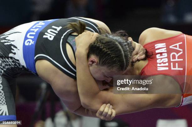 Beste Altug of Turkey competes with Cynthia Vanessa Vescan of France during the women's 72kg category match within the 2018 European Wrestling...