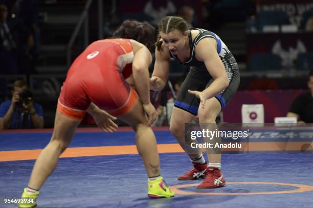 Beste Altug of Turkey competes with Cynthia Vanessa Vescan of France during the women's 72kg category match within the 2018 European Wrestling...