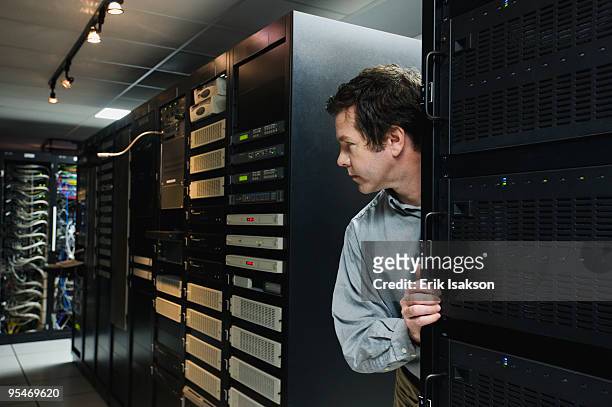 man working in data center - stealing data stock pictures, royalty-free photos & images