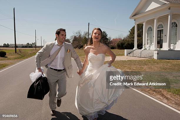married couple running - bride running stock-fotos und bilder