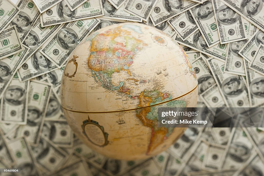 Globe on US dollars background