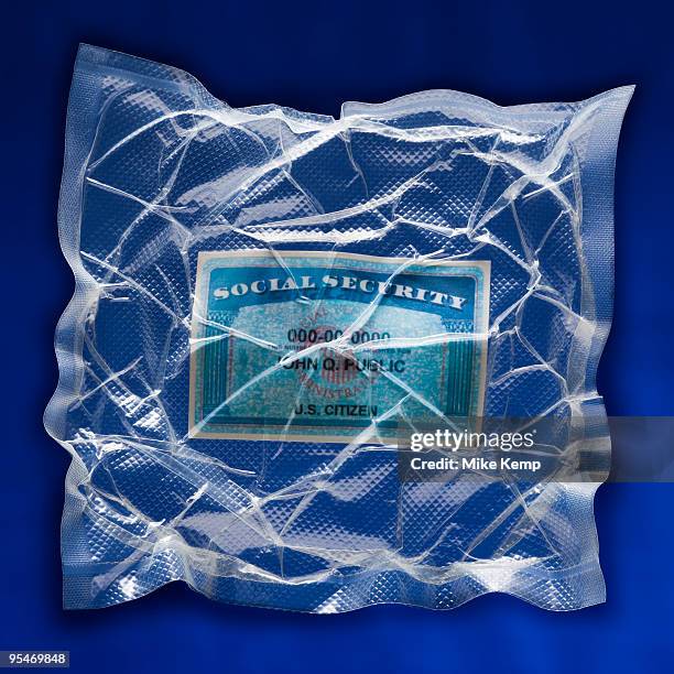 shrink wrapped social security card - social security card stock pictures, royalty-free photos & images