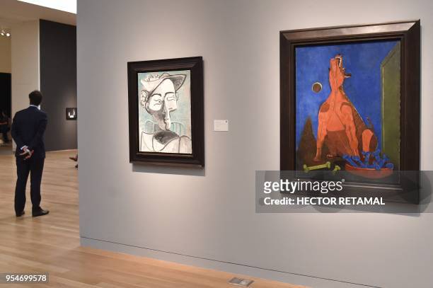 "Perro aullando a la Luna" by Rufino Tamayo and "Femme au Chapeau Assise. Buste" by Pablo Picasso are seen during a Sotheby's preview of the May...