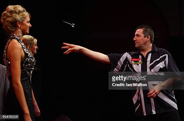 Ronnie Baxter of England in action against Gary Anderson of Scotland during the 2010 Ladbrokes.com World Darts Championship Round One at Alexandra...