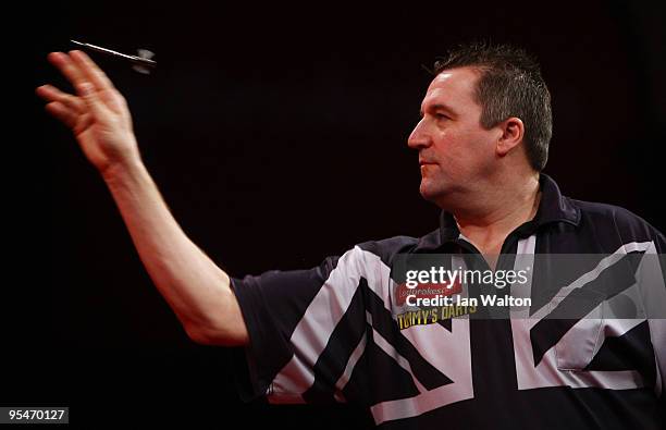 Ronnie Baxter of England in action against Gary Anderson of Scotland during the 2010 Ladbrokes.com World Darts Championship Round One at Alexandra...