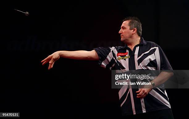 Ronnie Baxter of England in action against Gary Anderson of Scotland during the 2010 Ladbrokes.com World Darts Championship Round One at Alexandra...