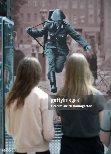 Young visitors of the Museum of History of the Federal Republic of Germany, in front of one of the most famous photos of the Cold War. Conrad...