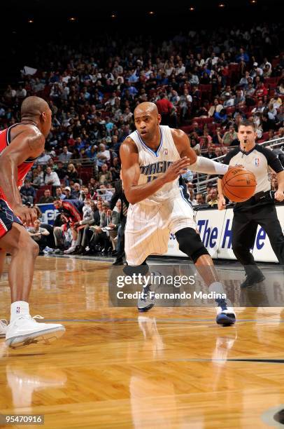 Vince Carter of the Orlando Magic drives the ball against Bobby Simmons of the New Jersey Nets during the game on November 13, 2009 at Amway Arena in...