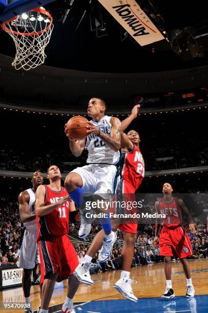 Matt Barnes of the Orlando Magic puts up a shot against Bobby Simmons of the New Jersey Nets during the game on November 13, 2009 at Amway Arena in...