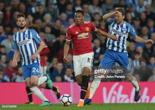 Anthony Martial of Manchester United in action with Dale Stephens of Brighton and Hove Albion during the Premier League match between Brighton and...