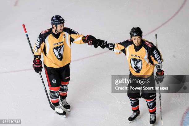 Empire Skater Bin Ishioka and Naoki Kaneko of Empire Skate celebrates after scoring during the Mega Ice Hockey 5s match between Singapore Hawkers and...