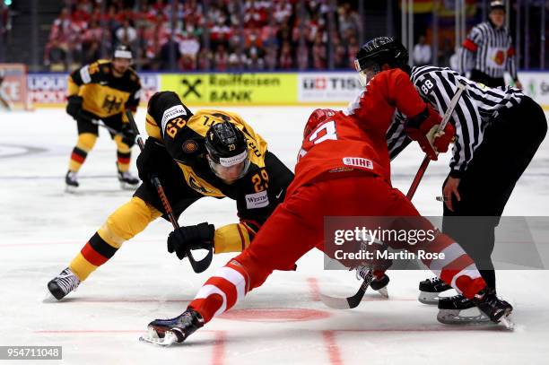 Leon Draisaitl of Germany faces Peter Regin of Denmark during the 2018 IIHF Ice Hockey World Championship group stage game between Germany and...
