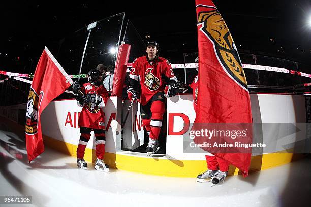 Chris Kelly of the Ottawa Senators steps onto the ice during player introductions prior to a game against the Boston Bruins at Scotiabank Place on...