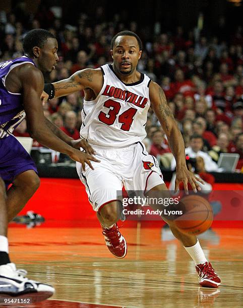 Jerry Smith of the Louisville Cardinals dribbles the ball during the game against the Western Carolina Catamounts on December 12, 2009 at Freedom...
