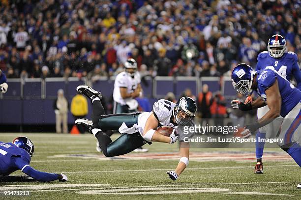 Brent Celek of the Philadelphia Eagles gets tripped up during a NFL game against the New York Giants on December 13, 2009 at Giants Stadium in East...