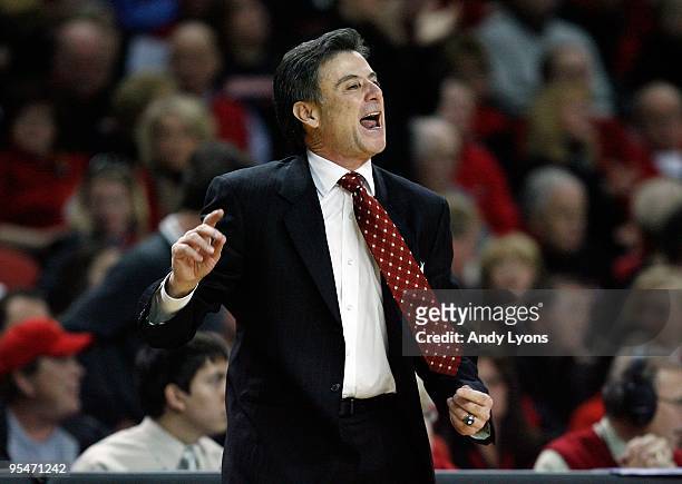 Head coach Rick Pitino of the Louisville Cardinals gives instructions to his team during the game against the Western Carolina Catamounts on December...