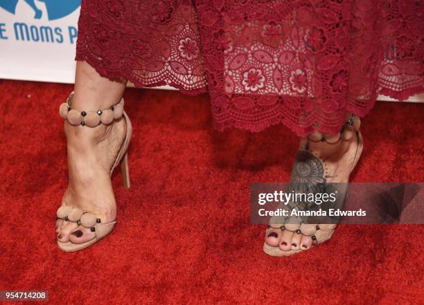 Actress, dancer and singer Mayte Garcia, shoe and tattoo detail, arrives at The Single Mom's Awards presented by Single Moms Planet at The Peninsula...