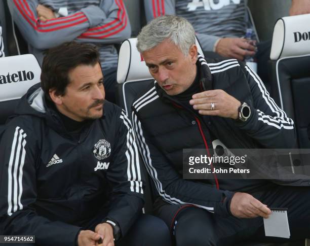 Manager Jose Mourinho and Assistant Manager Rui Faria of Manchester United watch from the bench during the Premier League match between Brighton and...